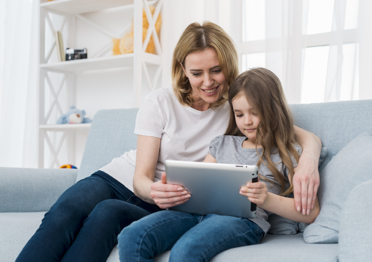 Mom and kid looking at screen